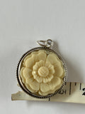 Joan Slifka Carved Rose Pendant with cherub