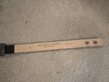 Leather belt with 'Streets Ahead' branding on a textured surface